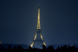 The full Eiffel Tower at night in Paris.