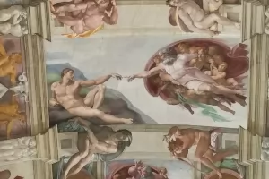 A view of the Sistine Chapel's famous ceiling painting, The Creation of Men, by Michelangelo.