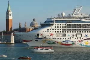 A large cruise ship in the Grand Canal of Venice.