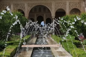 A view of the interior garden and fountain at the Alhambra in Andalusia, Spain.